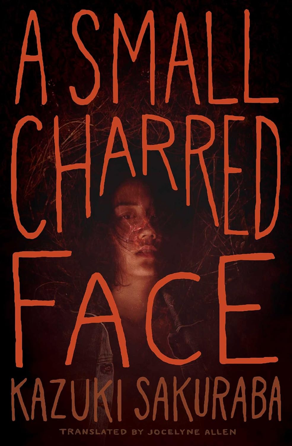 A small charred face